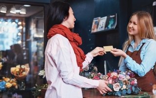 Young girl buying a bouquet of flowers